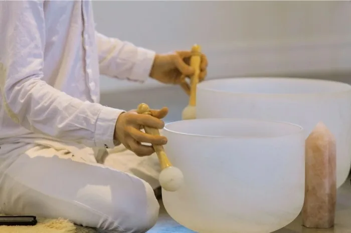 Singing bowls used during a chakra balancing session
