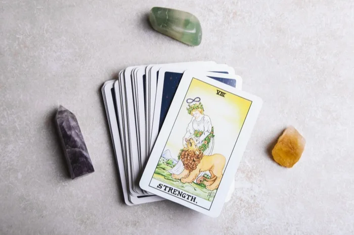 Tarot cards and healing crystals laid out for a reading